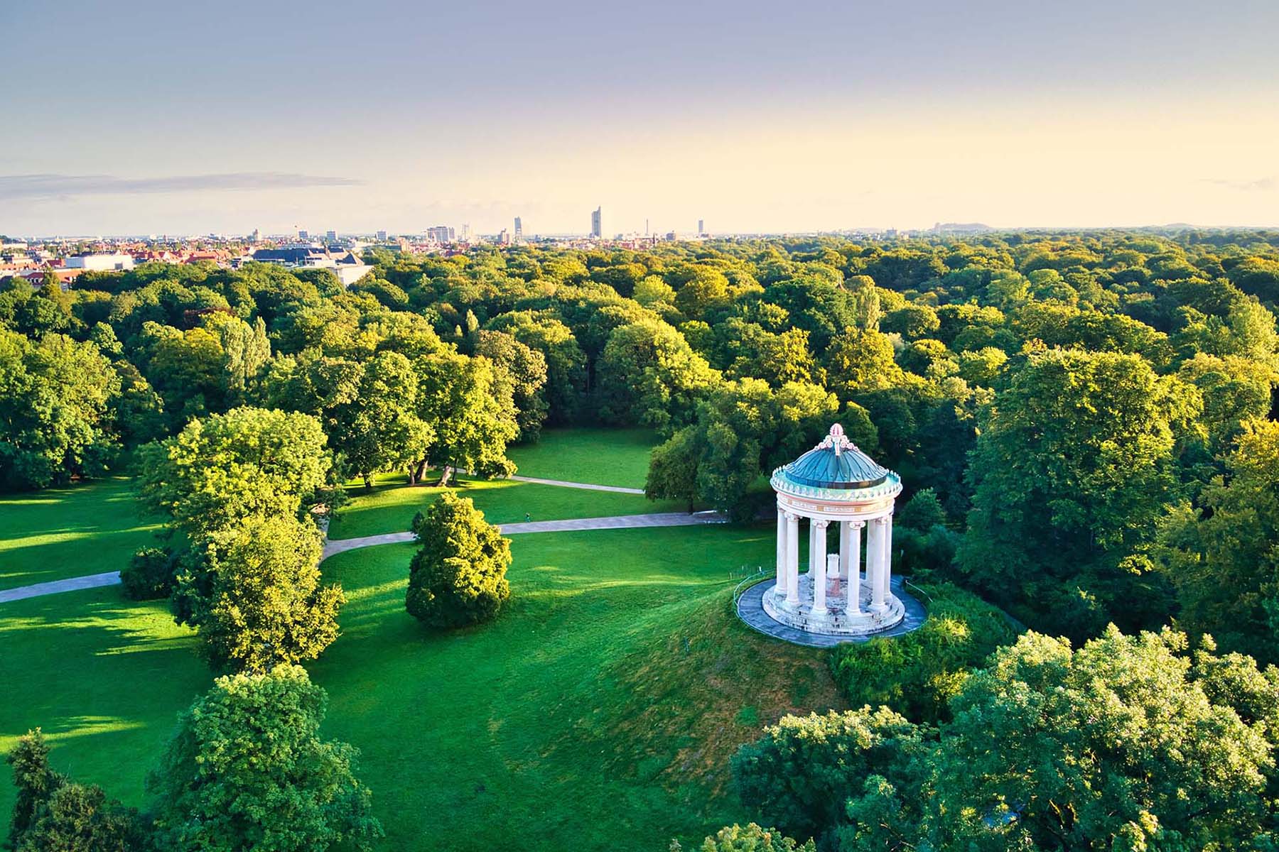 Monopteros in English Garden Replica Greek temple with garden views build in 19th century in Munich central Park Aerial drone shot during summer