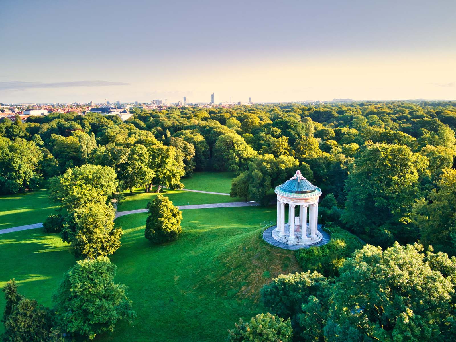 Monopteros in English Garden Replica Greek temple with garden views build in 19th century in Munich central Park Aerial drone shot during summer