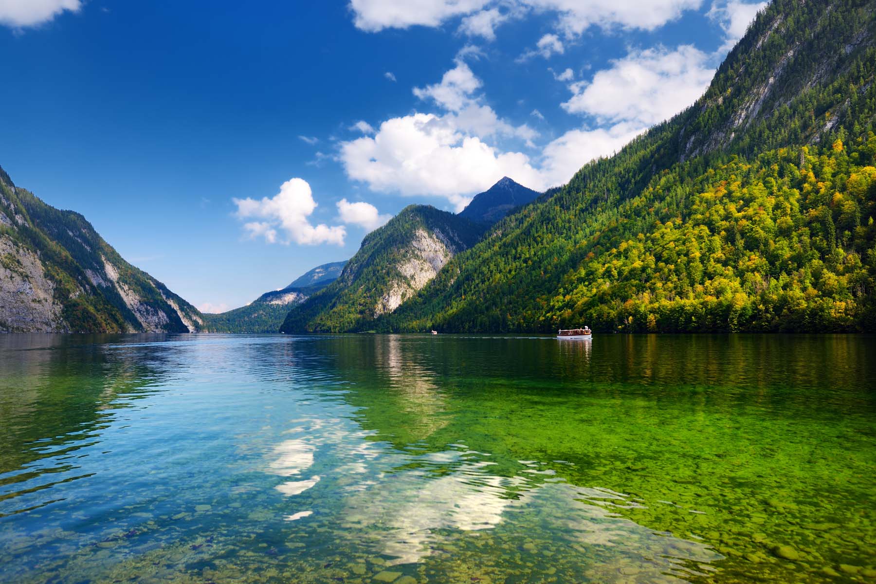 Stunning deep green waters of Konigssee, known as Germany's deepest and cleanest lake, located in the extreme southeast Berchtesgadener Land district of Bavaria, near the Austrian border.
